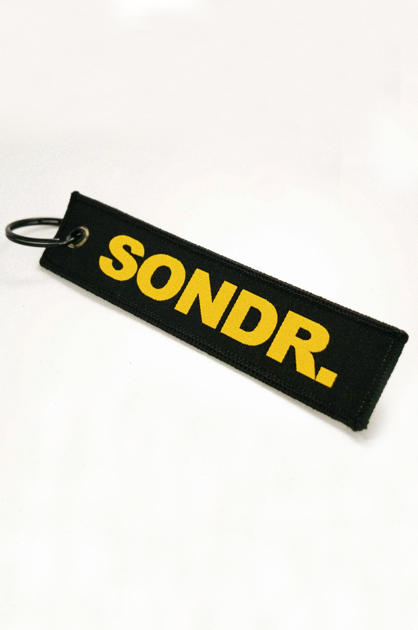 Spotlight Image of Black SONDR. Flight Tag on angle