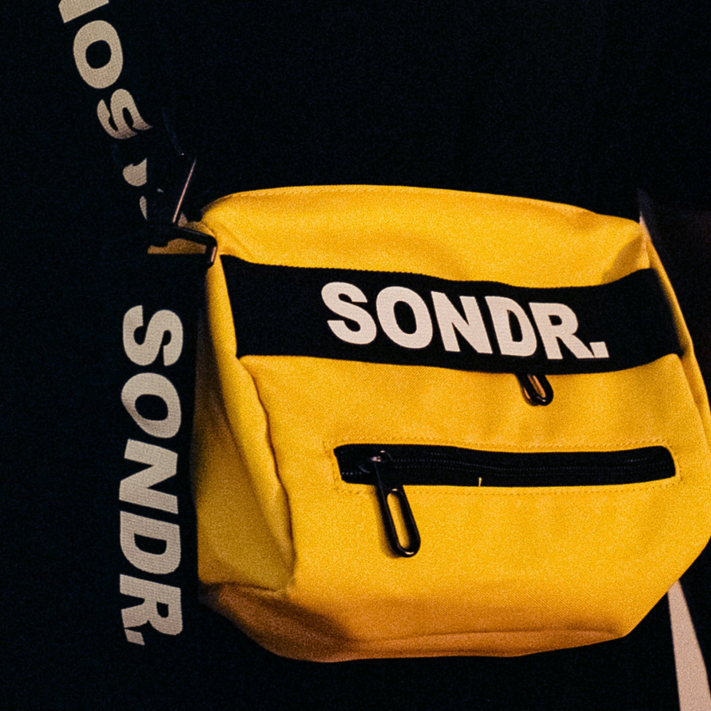 Close up shot of SONDR. Yellow Side Bag Product Image. Showing shoulder trap print & yellow tag